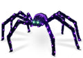 Black giant spider with purple-lit legs and body and green eyes on a white background