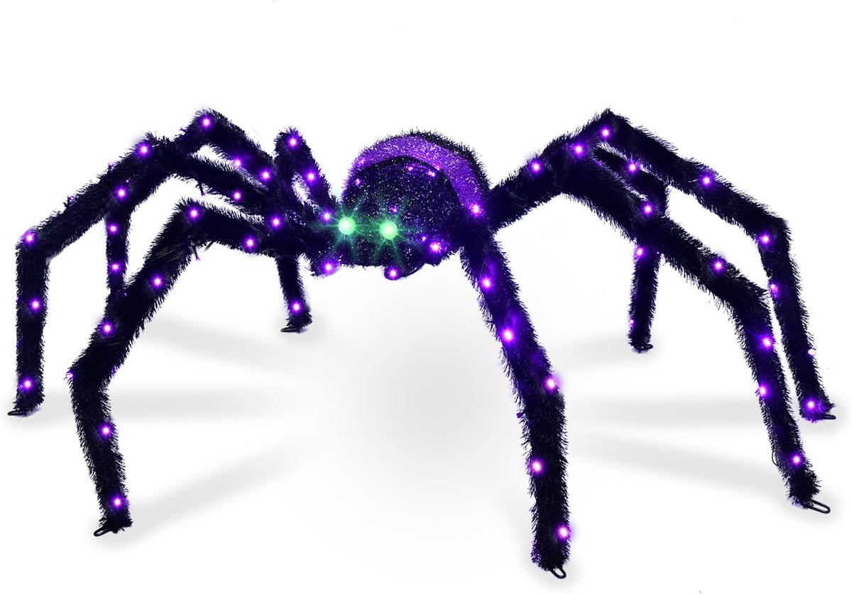 Black giant spider with purple-lit legs and body and green eyes on a white background