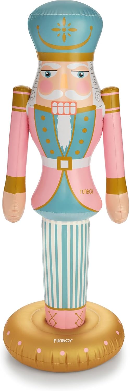 Pastel pink and mint nutcracker inflatable standing on a round gold base
