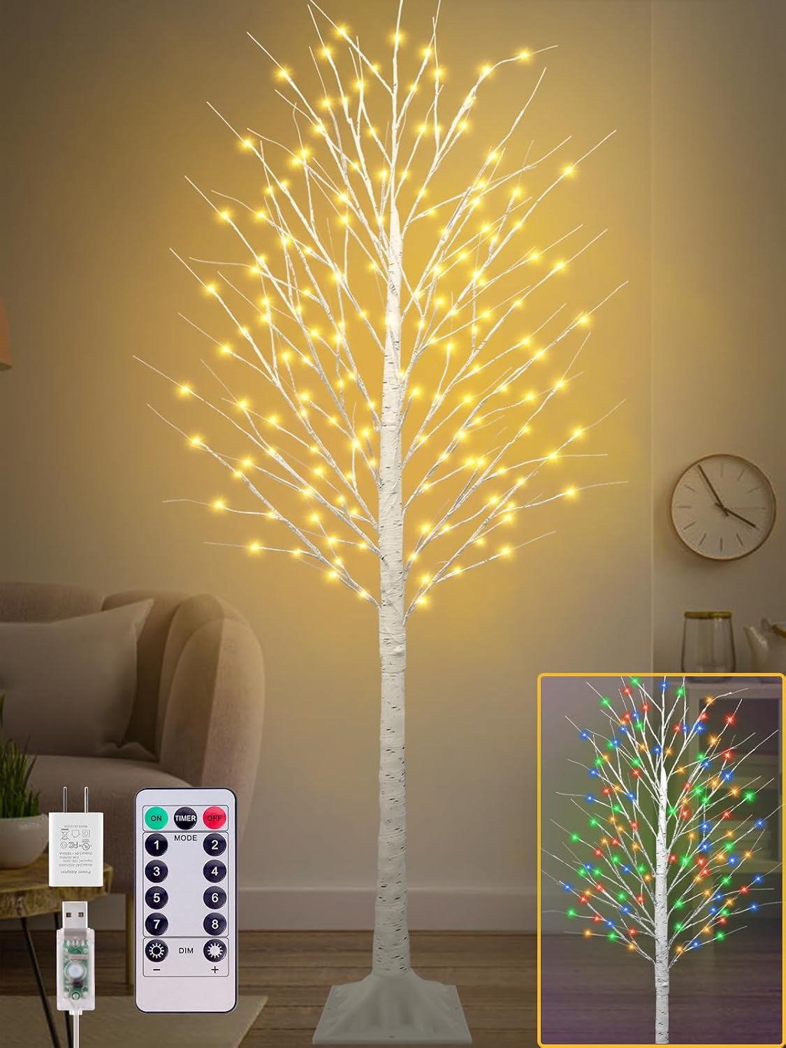 Tall white birch tree with warm fairy lights in a living room, with a remote and a multicolor inset