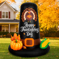 Giant black pilgrim hat inflatable reading Happy Thanksgiving Day with pumpkins and corn on a fall lawn