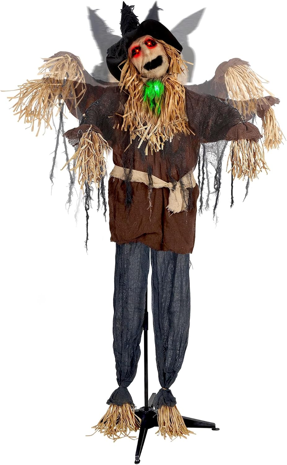Tall scarecrow prop in a tattered hat and burlap coat on a pole stand