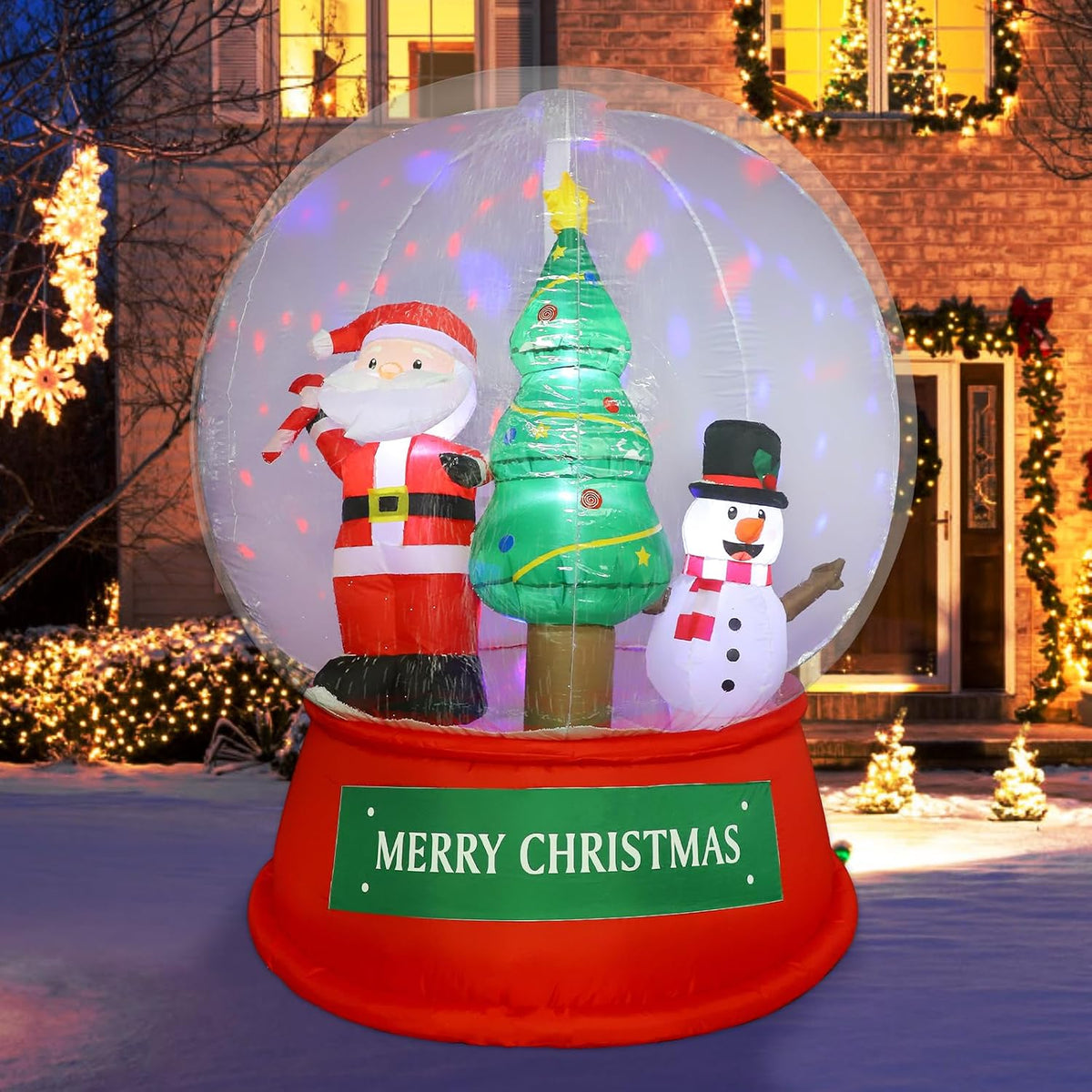 Snow globe inflatable on a red Merry Christmas base with Santa, a tree and a snowman inside