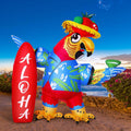 Red and blue parrot inflatable in a straw hat beside a red ALOHA surfboard by the sea