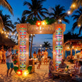 Tiki pole arch inflatable with an ALOHA sign at an evening beach luau