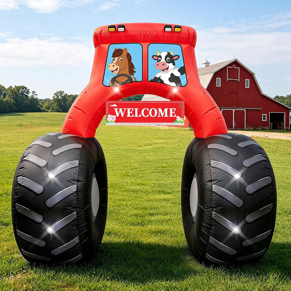 Red tractor arch inflatable with a cow and horse in the windows and a Welcome sign in front of a barn
