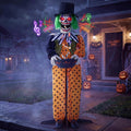 Creepy clown prop in a polka-dot suit and top hat holding a candy bowl on a foggy porch