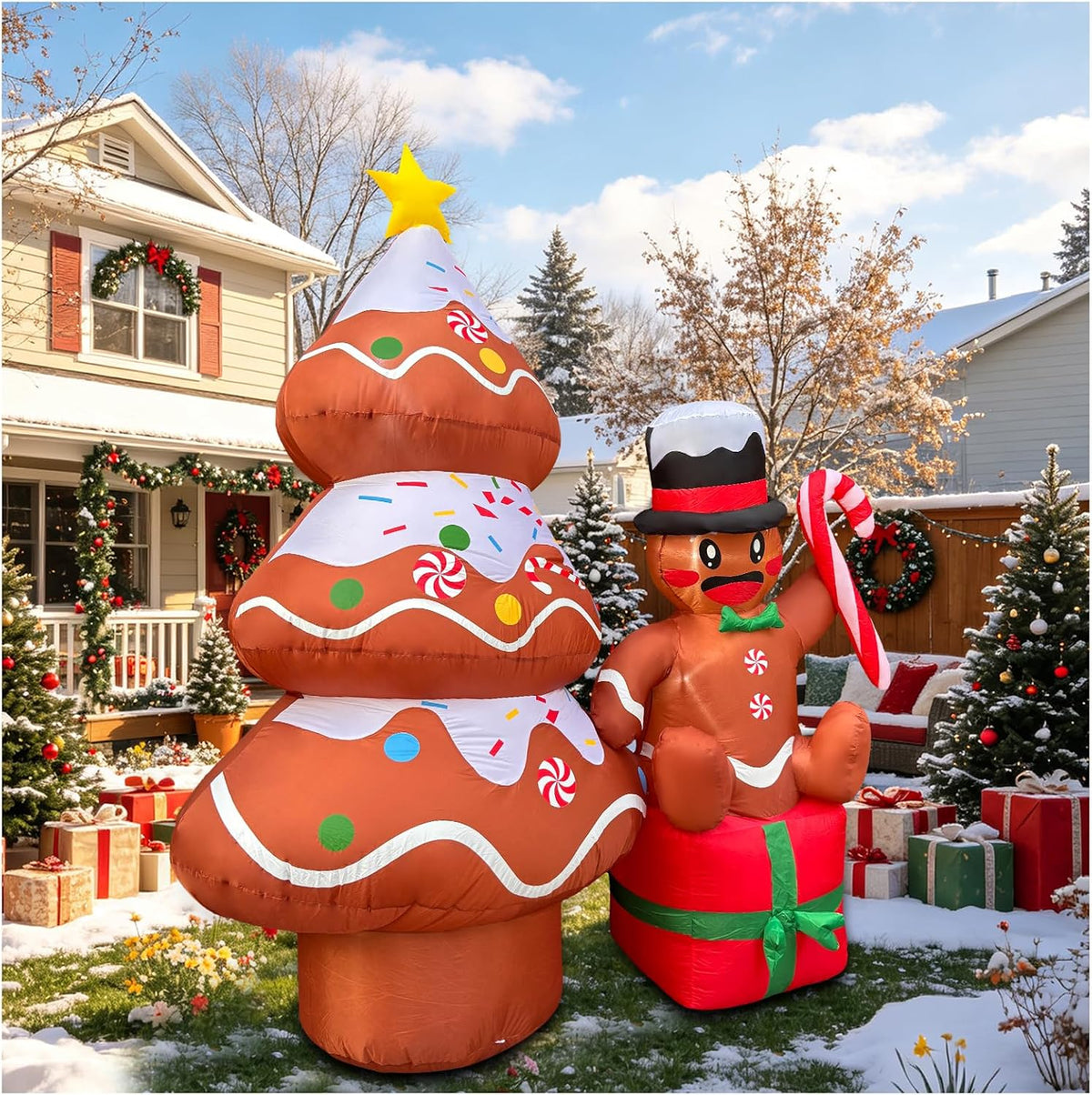 Frosted gingerbread tree inflatable with a gold star beside a gingerbread man in a top hat